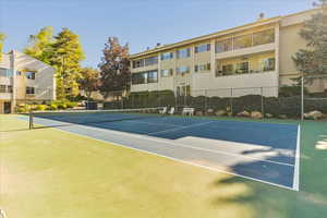 View of tennis court with fence