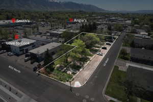Aerial view of property's location featuring a mountainous background and property boundaries highlighted