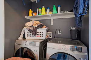 Laundry room with laundry area and separate washer and dryer