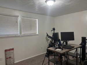 Office area with carpet flooring and baseboards