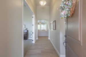 Entryway featuring baseboards and a ceiling fan