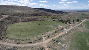 Aerial view featuring a rural view and a mountain view