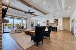 Open concept floor plan with sliding glass wall that opens to a back yard oasis