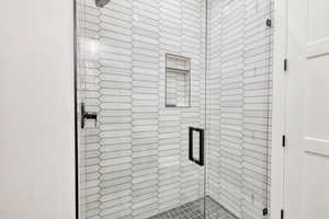 Bathroom 4 with a tiled stall shower