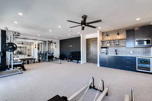Grand gathering space with a wet bar. Can be used as a family room, home gym, theater room, or game room