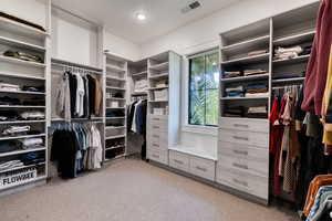 Primary walk-in closet with custom-built-ins