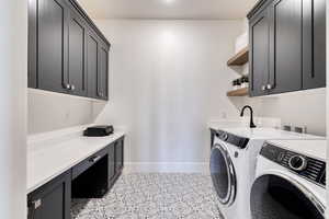 Main level laundry room with decorative tile floor