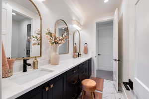 Bathroom 4 featuring double sink vanity, upgraded tiled floor, and recessed lighting