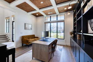 Living room/home office with beam coffered ceiling and cork inlay.