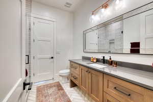 Bathroom 2 with double sink vanity and shower
