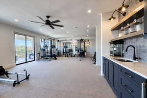 Grand room leading out to a covered deck with views of the mountains and temple