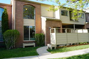 View of front of home featuring brick siding