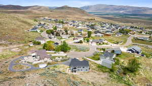 Drone / aerial view featuring a mountain view and a residential view