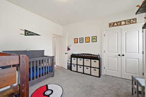 Bedroom with carpet flooring and a closet