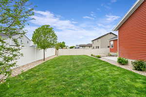 View of yard featuring a residential view and a fenced backyard