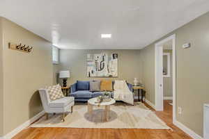 Living room featuring baseboards and light wood finished floors