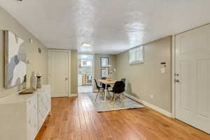 Dining room with plenty of natural light, visible vents, light wood-style flooring, and baseboards