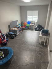 Playroom with a textured ceiling