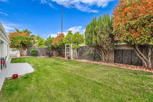 View of yard featuring a patio and a fenced backyard