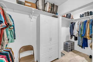 Spacious closet featuring light tile patterned floors