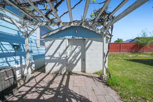Garage with fence and a shed