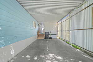 View of patio / terrace with a carport