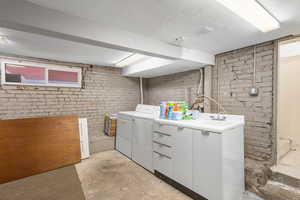 Basement laundry with new window and laundry sink
