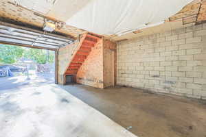 Garage interior with door to loft