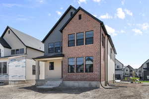 View of front of property with brick siding