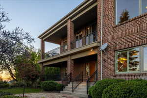 View of rear of house with a 2 covered decks