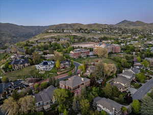 Birds eye view of property featuring a mountain view and a residential view