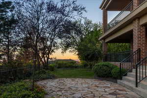 Patio terrace at dusk featuring sunsets