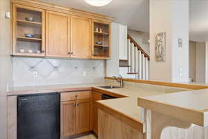 Lower Level Great Room Wet Bar featuring a sink, a peninsula, beverage refrigerator