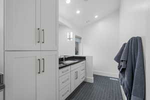 Bathroom with recessed lighting, baseboards, visible vents, tile patterned floors, and vanity