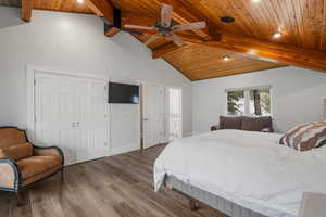 Bedroom with a closet, recessed lighting, wooden ceiling, wood finished floors, and lofted ceiling with beams