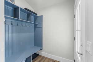 Mudroom featuring baseboards, visible vents, and dark wood-type flooring