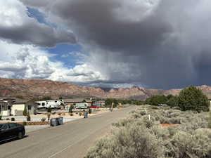 View of road featuring a residential view and a mountain view