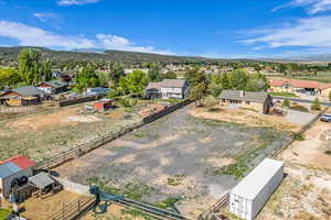 Drone / aerial view featuring a mountain view and a residential view