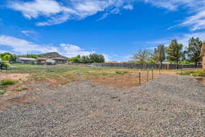 View of yard featuring fence