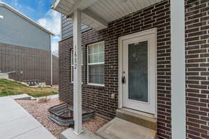 Property entrance with brick siding