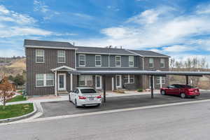 Townhome / multi-family property with brick siding