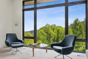 Sunroom / solarium with a mountain view
