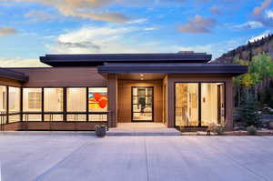 Back of house featuring a porch