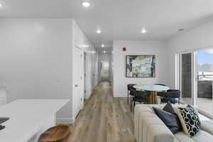 Interior space featuring light wood-style floors, baseboards, and recessed lighting