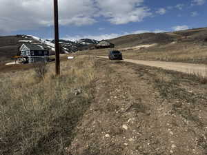 View of street with a rural view and a mountain view