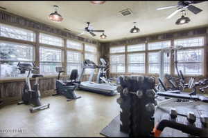 Gym featuring a ceiling fan and visible vents