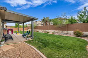 View of yard featuring a patio area and a fenced backyard