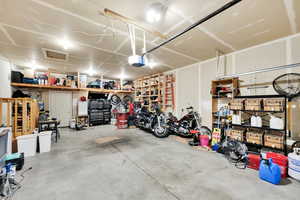 Garage featuring a garage door opener