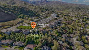 Birds eye view of property with a mountain view and a residential view