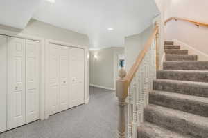 Staircase with carpet flooring, baseboards, and recessed lighting